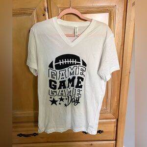 Bella + Canvas “Game Game Game Day” Football Graphic V-Neck Tee – White